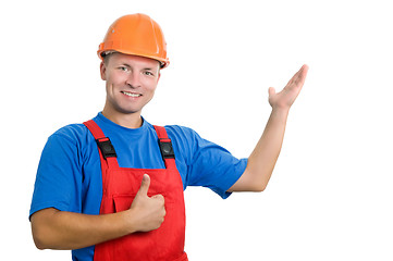 Image showing builder in uniform pointing up