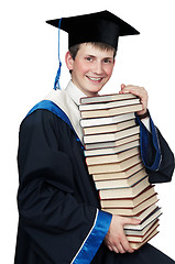 Image showing graduate in gown with books