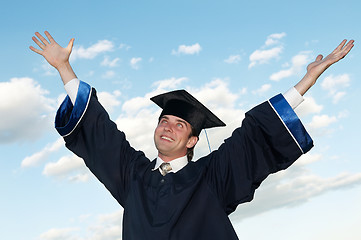 Image showing happy graduate with risen arms