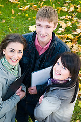 Image showing Group of smiling young students outdoors