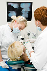 Image showing dentist doctors at teeth treatment work