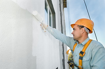 Image showing builder facade painter at work
