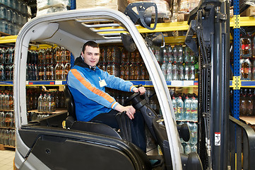 Image showing happy forklift worker at warehouse