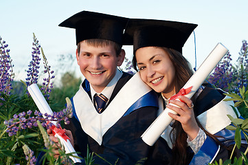 Image showing Two Happy Graduate outdoors