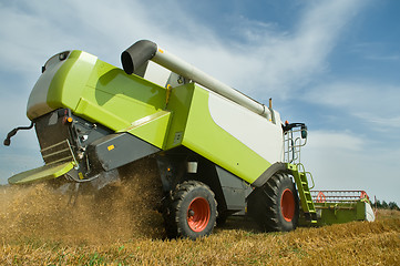 Image showing harvesting combine in field