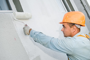 Image showing builder facade painter at work