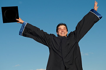 Image showing graduate with open arms outdoors