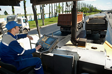 Image showing Asphalt spreading machine worker