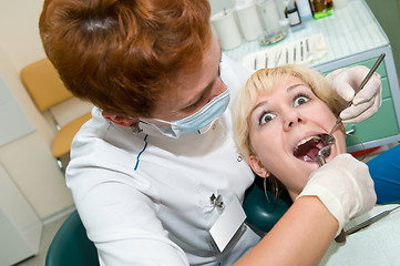 Image showing dental exodontia with scared patient
