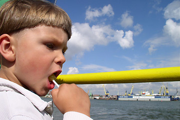 Image showing Child Eating a Candy