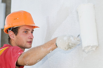 Image showing builder facade painter at work