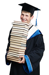 Image showing graduate in gown with books