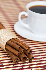 Image showing cinnamon and cup of coffee