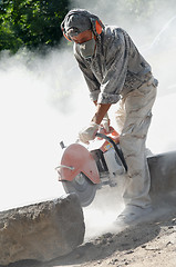 Image showing builder at cutting work