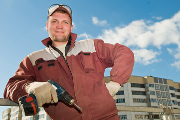 Image showing happy worker with screwdriver