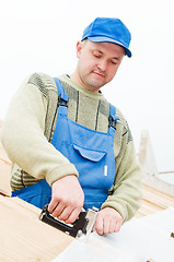 Image showing roofing works with staple gun