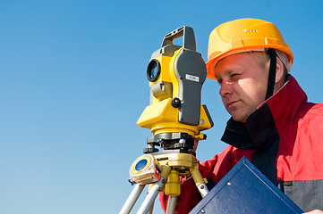 Image showing Surveyor looking at the thedolite