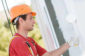 Image showing builder facade painter at work