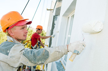 Image showing builder facade painter at work