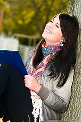 Image showing Portrait of cheerful student outdoors