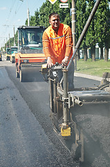 Image showing Young paver worker at asphalting works