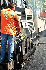 Image showing Young paver worker at asphalting works