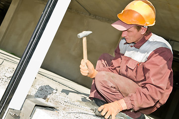 Image showing worker with hammer