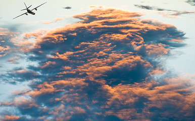 Image showing airplane over Sunset cloudscape