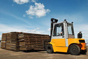 Image showing forklift loader at warehouse works 