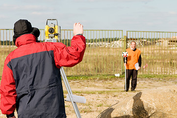 Image showing surveyor works with theodolite