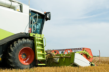 Image showing close-up harvesting combine