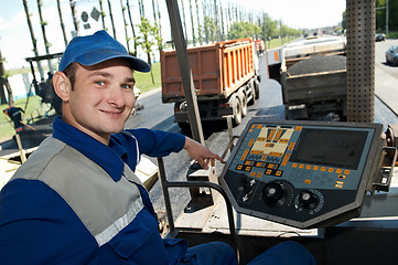 Image showing Young paver worker at asphalting works