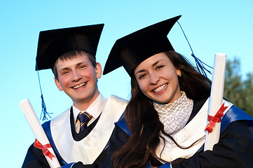 Image showing Two smiley Graduate outdoors