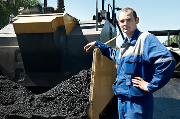 Image showing Young paver worker at asphalting works