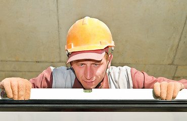 Image showing Builder worker using level tool