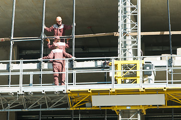 Image showing restoration work of buildings at climbing platform