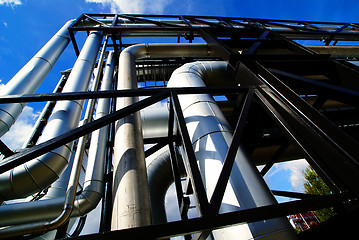 Image showing Industrial zone, Steel pipelines and valves against blue sky