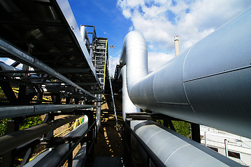 Image showing Industrial zone, Steel pipelines and valves against blue sky