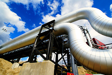 Image showing Industrial zone, Steel pipelines and valves against blue sky