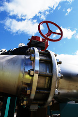 Image showing Industrial zone, Steel pipelines and valves against blue sky