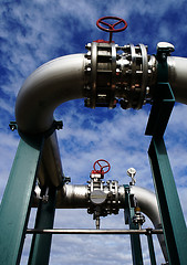 Image showing Industrial zone, Steel pipelines and valves against blue sky