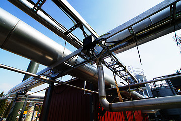 Image showing Industrial zone, Steel pipelines and valves against blue sky