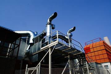 Image showing Industrial zone, Steel pipelines and valves against blue sky