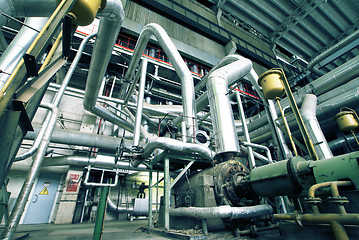 Image showing Equipment, cables and piping as found inside of a modern industr