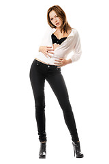 Image showing Young woman in black tight jeans