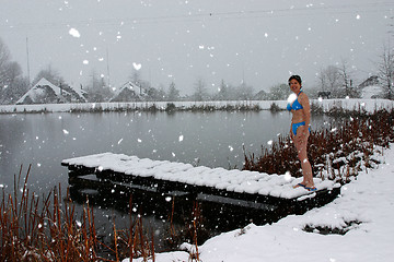 Image showing Woman in snow with bikini