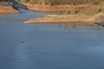 Image showing lonely rower on a mountain lake