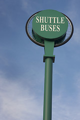 Image showing shuttle buses sign against blue sky