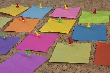 Image showing colorful blank sticky notes on cork board