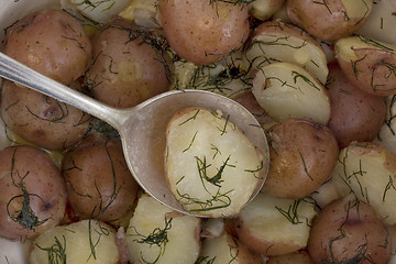 Image showing freshly cooked new red potatoes with tablespoon